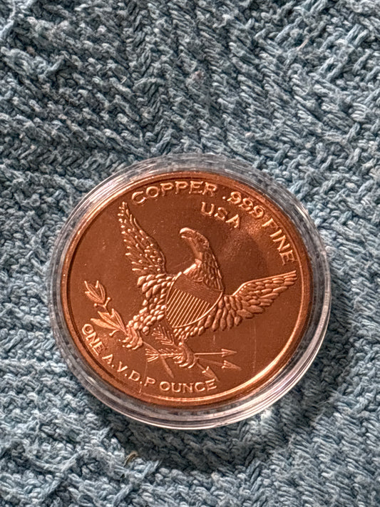 999 fine 1 Oz copper specialty round featuring Canadian maple leaf